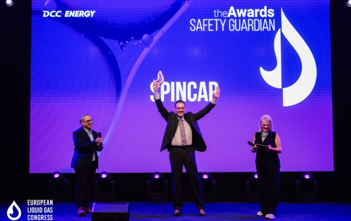 SPINCap team on stage receiving the Safety Guardian Award at ELGC 2025