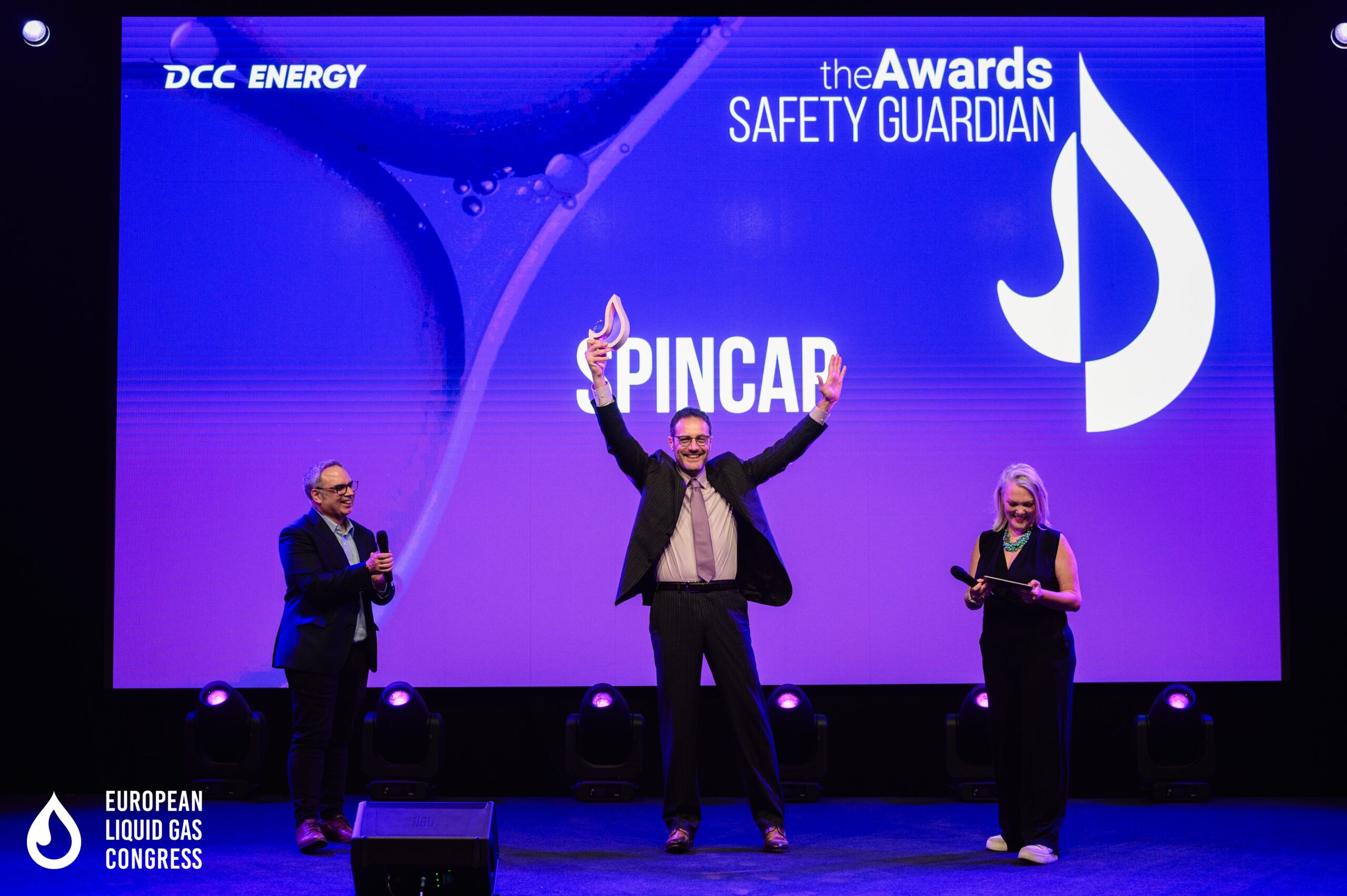 SPINCap team on stage receiving the Safety Guardian Award at ELGC 2025
